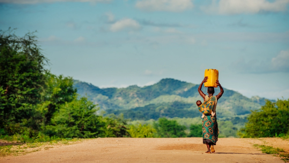 woman carrying water